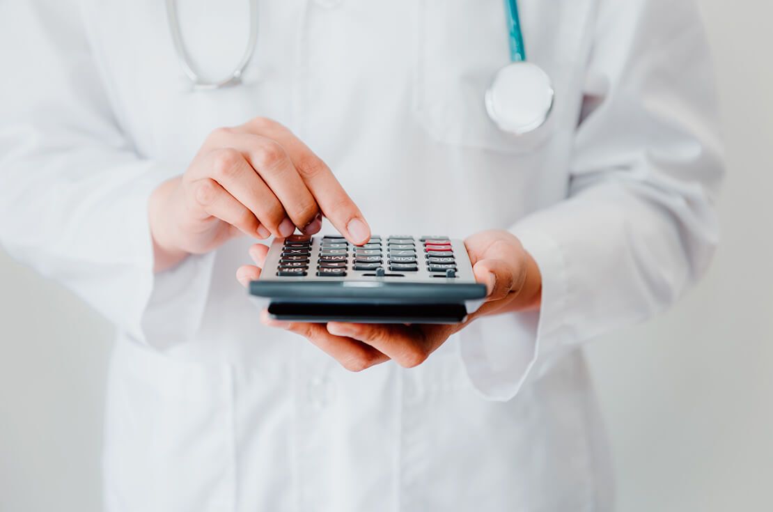 Female Doctor is Calculating Medicine Cost